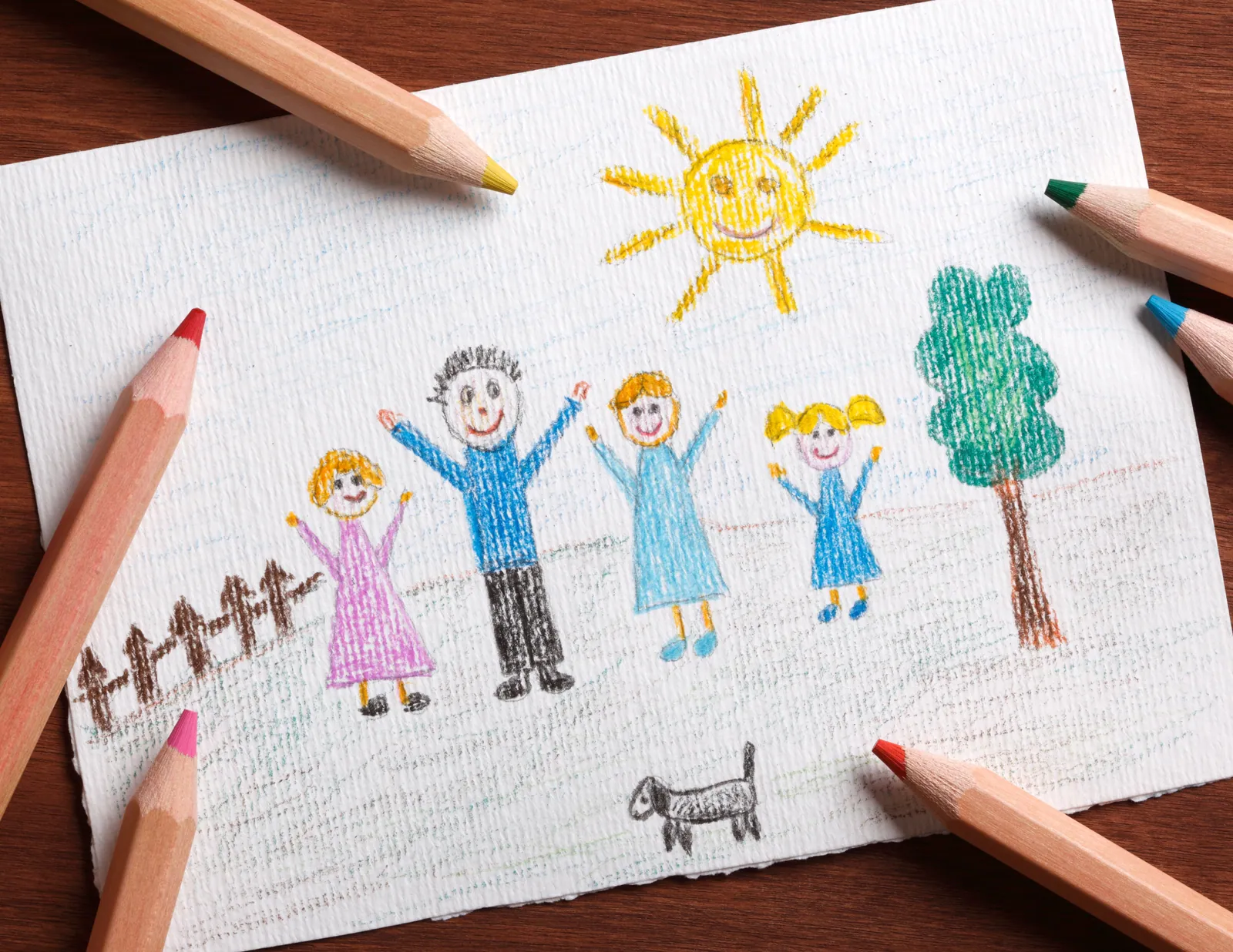 A child's drawing of their family on paper, made together as part of a shared family agreement