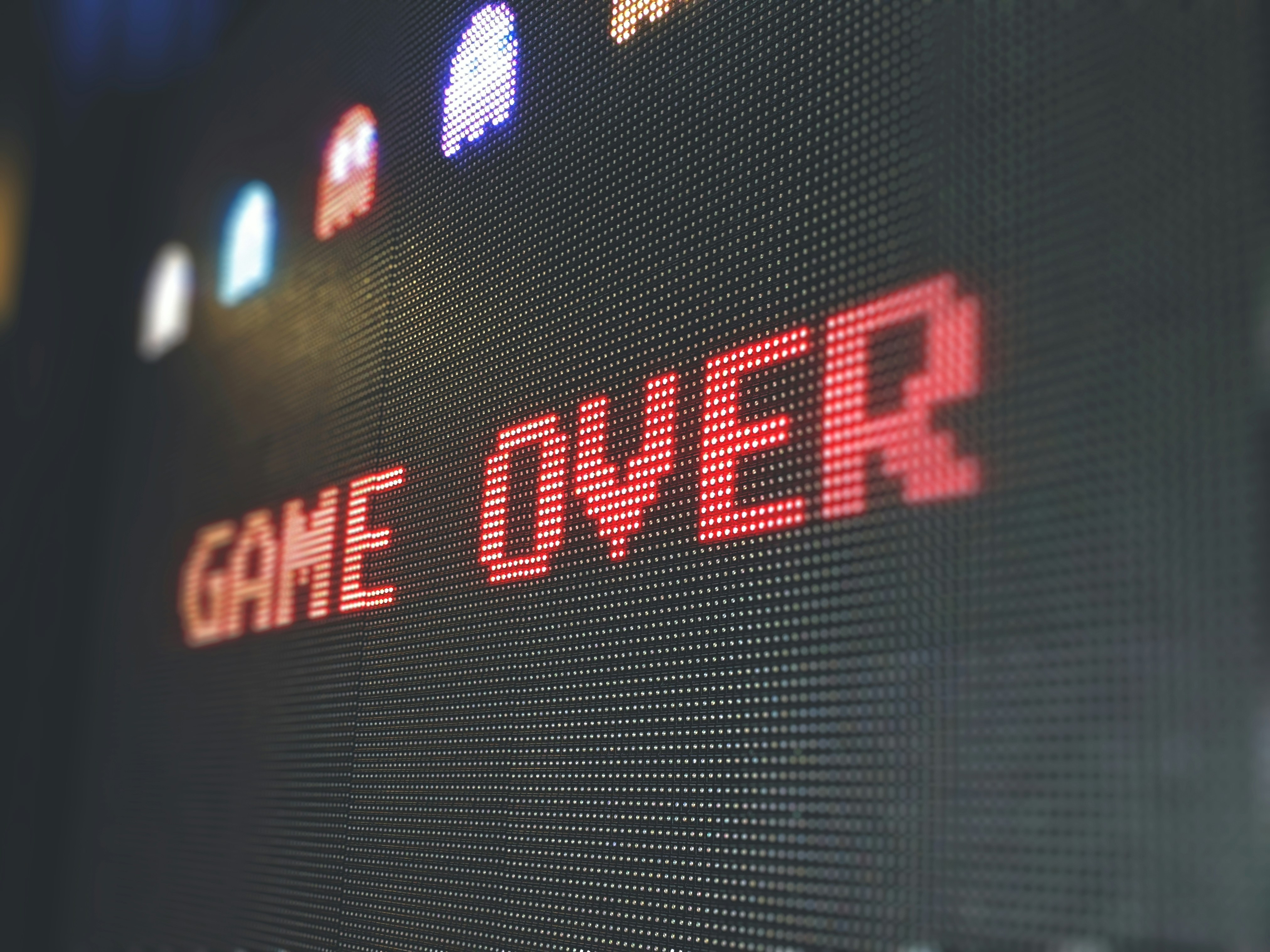An LED display reading GAME OVER in red pixel lettering