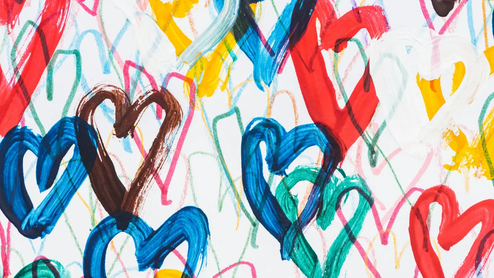 A vibrant hand-painted pattern of hearts and brushstrokes in joyful reds, blues, greens and yellows