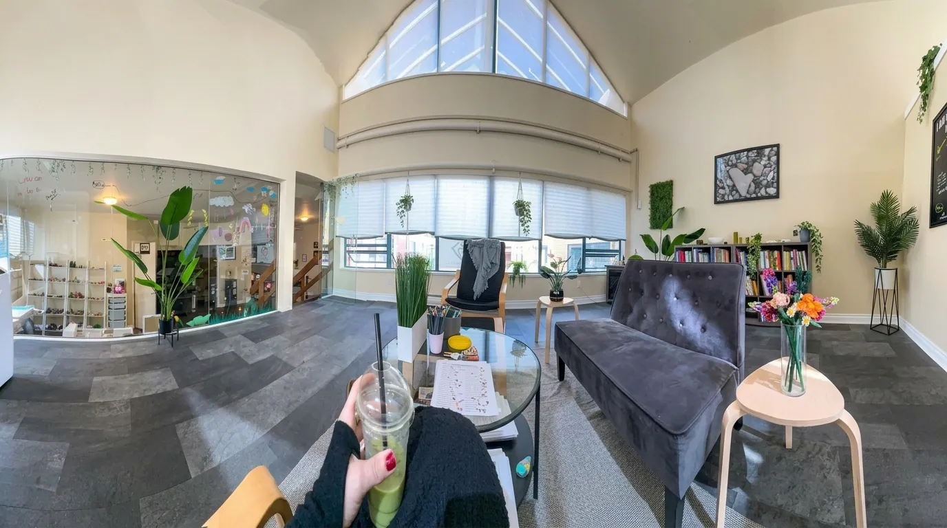 The counselling space — a bright, calm room with soft seating and natural light
