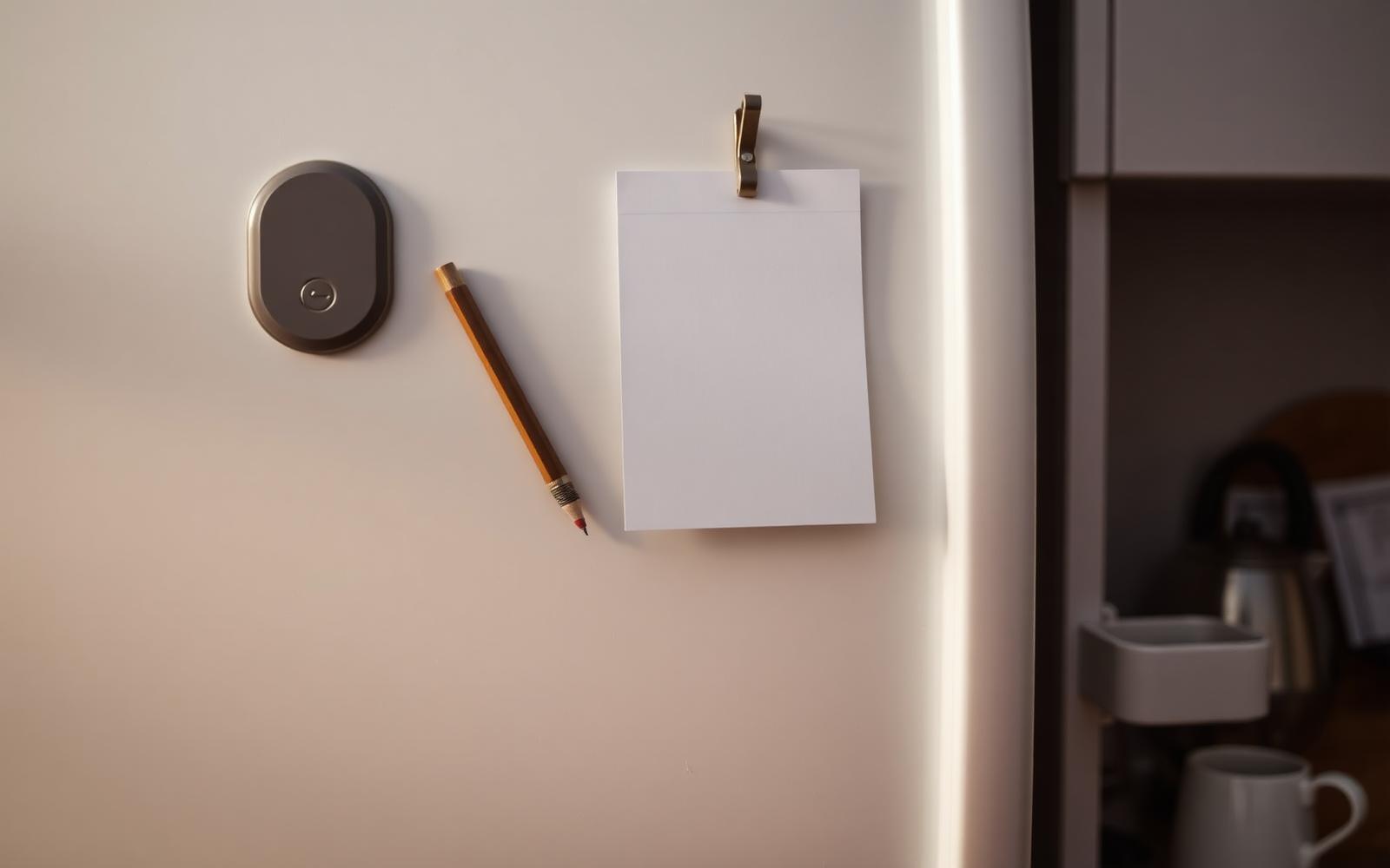 A wall-mounted chart with handwritten household tasks beside a hanging pencil